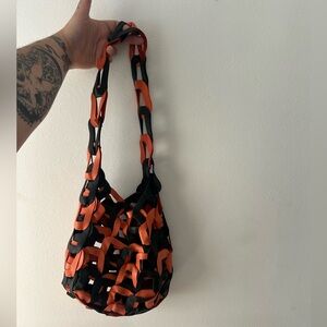 SC103 black and orange leather link tote